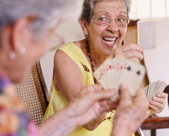 elderly woman playing cards