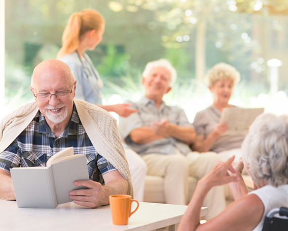 seniors reading books and talking